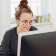 woman with glasses shopping online