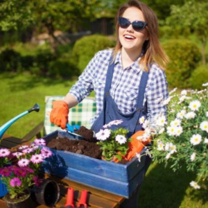 woman outside gardening while wearing UV sunglasses